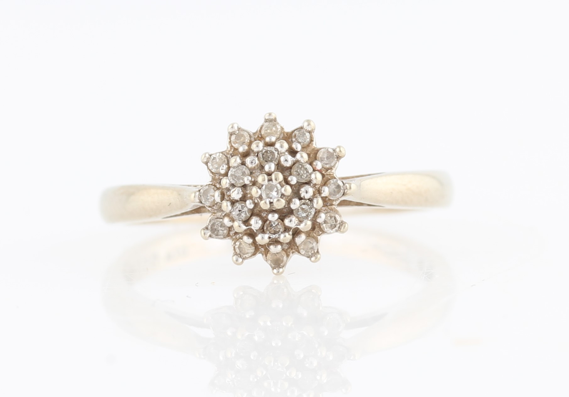 A hallmarked 9ct yellow gold diamond tiered cluster ring, set with three rows of eight-cut diamonds,