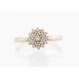 A hallmarked 9ct yellow gold diamond tiered cluster ring, set with three rows of eight-cut diamonds,
