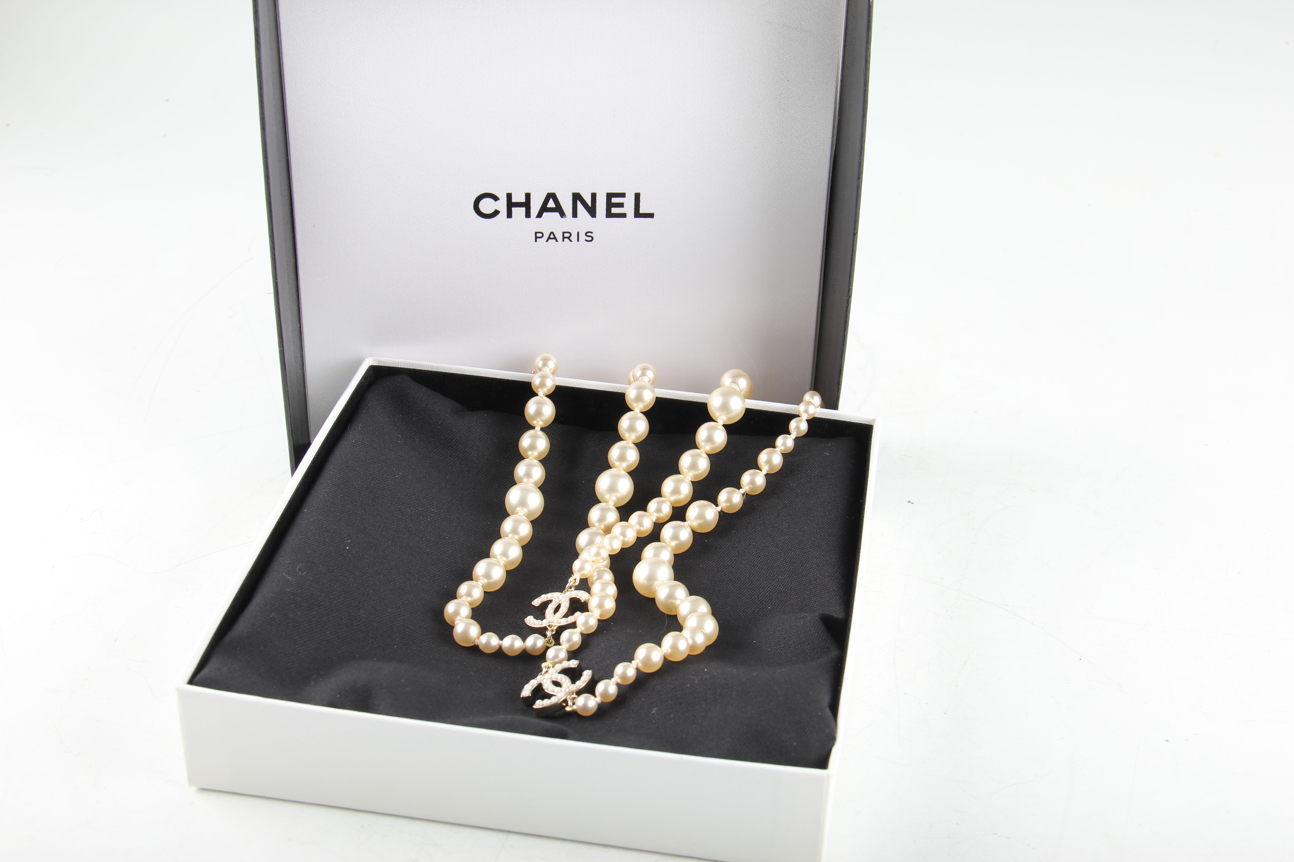 A 2006 Chanel opera length graduated simulated pearl necklet with interlocking ‘C’ logos, clasp - Image 2 of 2