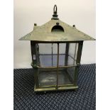 An Arts and Craft brass lantern with pegoda top and 4 glass panelled sides.