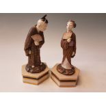 A pair of Royal Worcester Aesthetic Movement figures of a Japanese man and woman dated 1873 and 1874