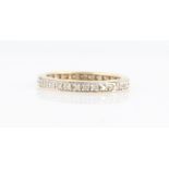 A hallmarked 9ct yellow gold diamond full eternity ring, set with 32 eight cut diamonds, total