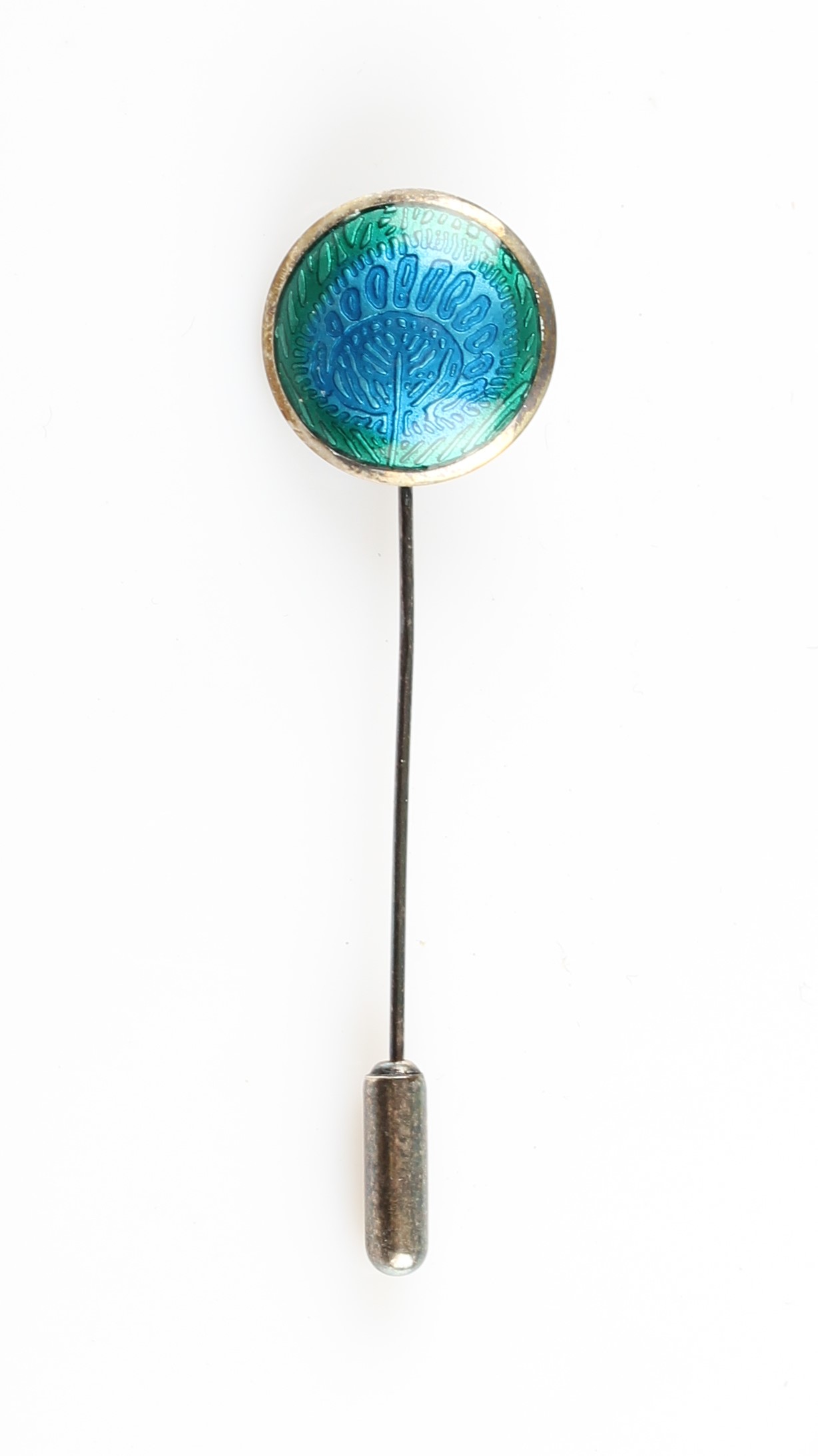 A Liberty & Co. silver and enamel stick pin, the circular metalwork featuring green to blue