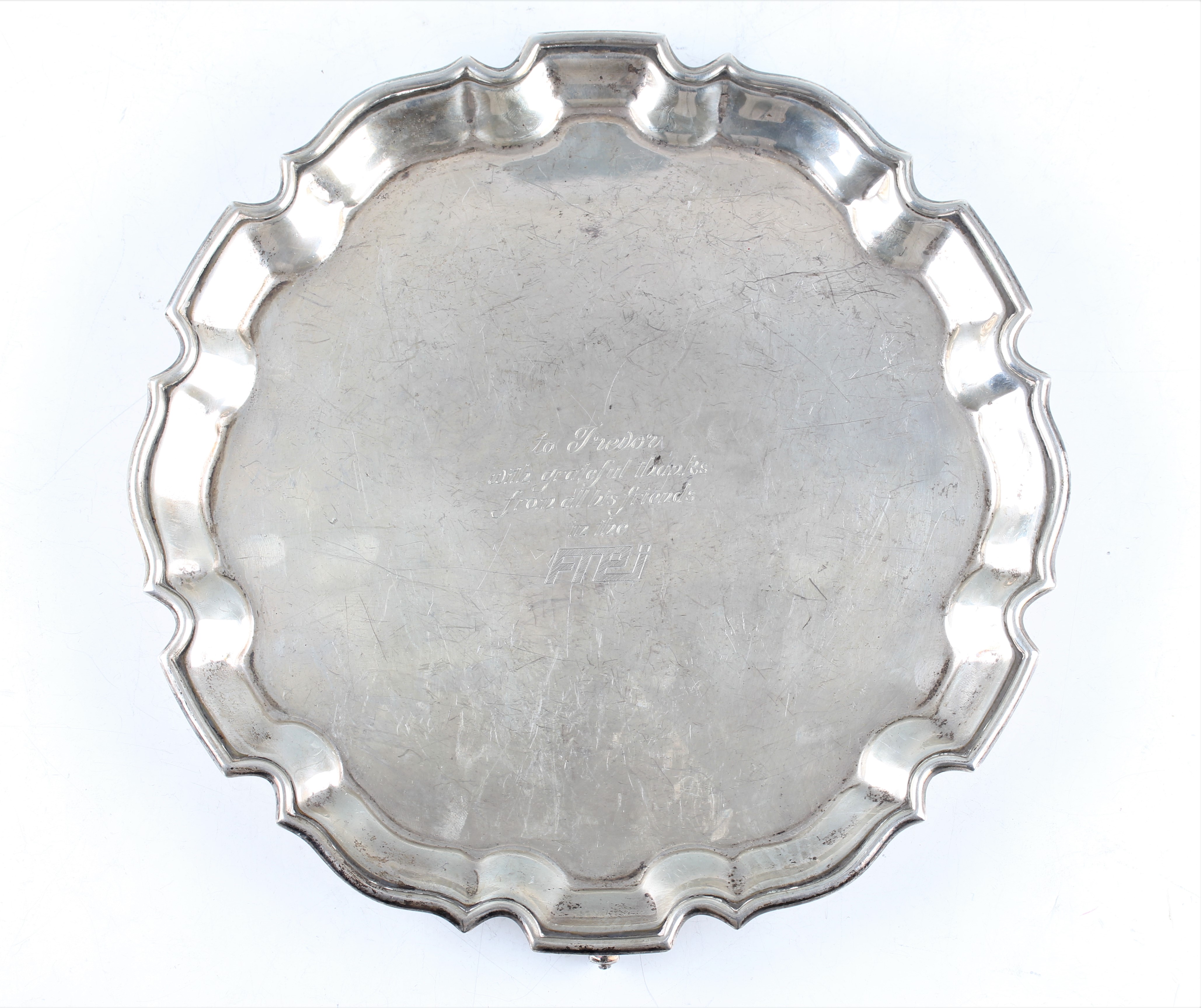 A silver salver, the circular form with pie crust rim and central personal engraving, raised on - Image 2 of 2