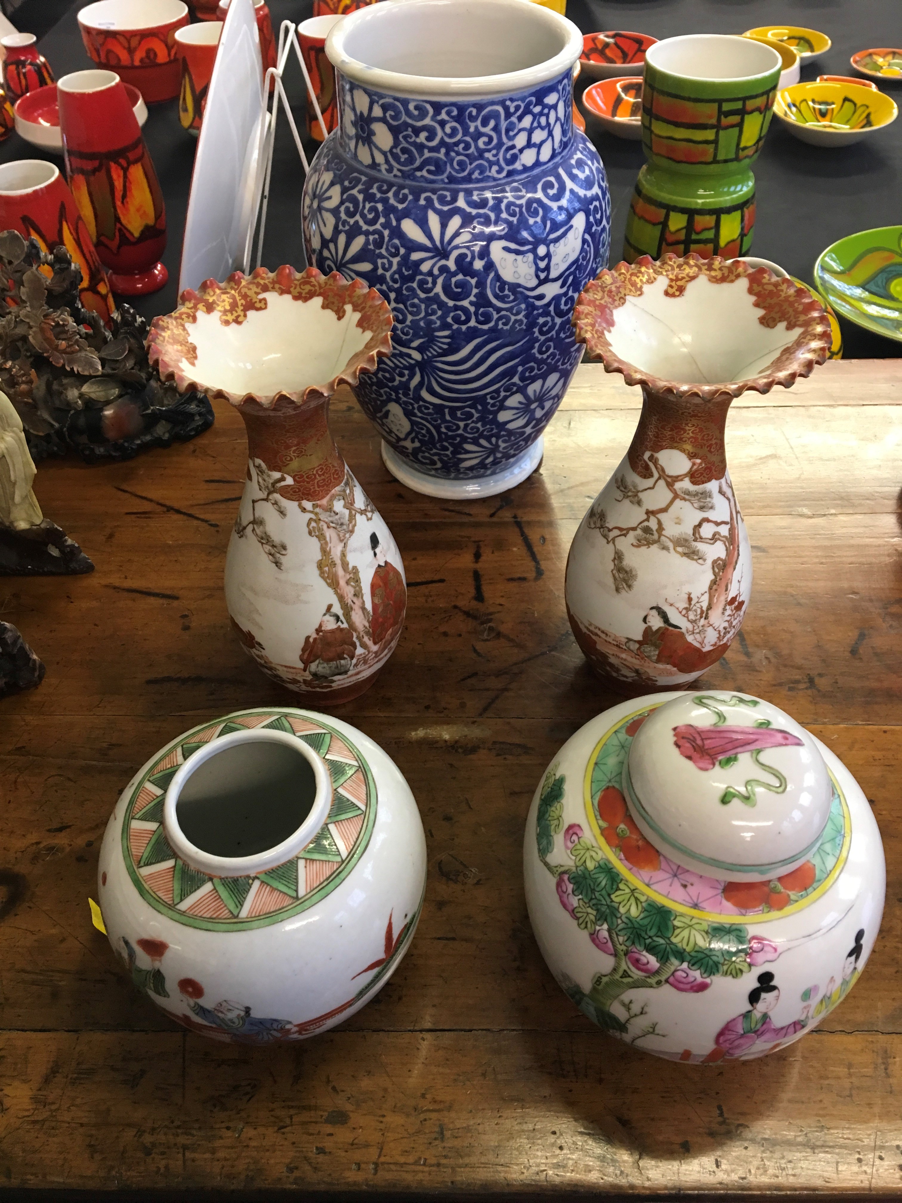 Two oriental ginger jars together with an oriental blue and white vase and a pair of satsuma vases