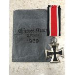 A German Second World War Iron Cross in blue packet.