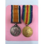 A First World War medal group of two awarded to W. W. Miller to include War Medal and Victory Medal,