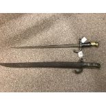 Two 19th Century French bayonets, one engraved with number 57610 and one with metal scabbard