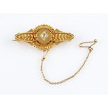 A Victorian diamond memorial brooch, the Etruscan design set with a central Old Mine cut diamond,