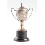 A hallmarked silver 'Fishing Contest' engraved twin handled trophy, height approx. 16cm.