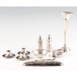 A collection of hallmarked silverware, to include a weighted bud vase, two pepperettes, a