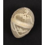 A fine French pierced and carved early 19th Century ivory thimble egg, the elaborately pierced