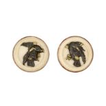 A pair of Japanese ivory and metal mounted buttons, of circular form each with a bid of prey in