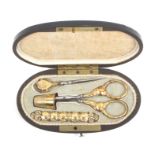 A mid-19th Century French etui, circa 1840, of oval form, the lid with brass cartouche amid florets,