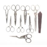 Eight pairs of steel scissors comprising two buttonholing pairs, a pair as a stork and a Solingen