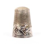 A French silver 'fairy tale' thimble, 'The Wolf and the Lamb', the frieze depicting a wolf