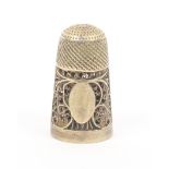 A late 18th Century silver gilt filigree thimble, lacking screw base and scent bottle, quill work