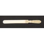 A good 19th Century Dieppe carved ivory letter knife, the handle and mount intricately carved with