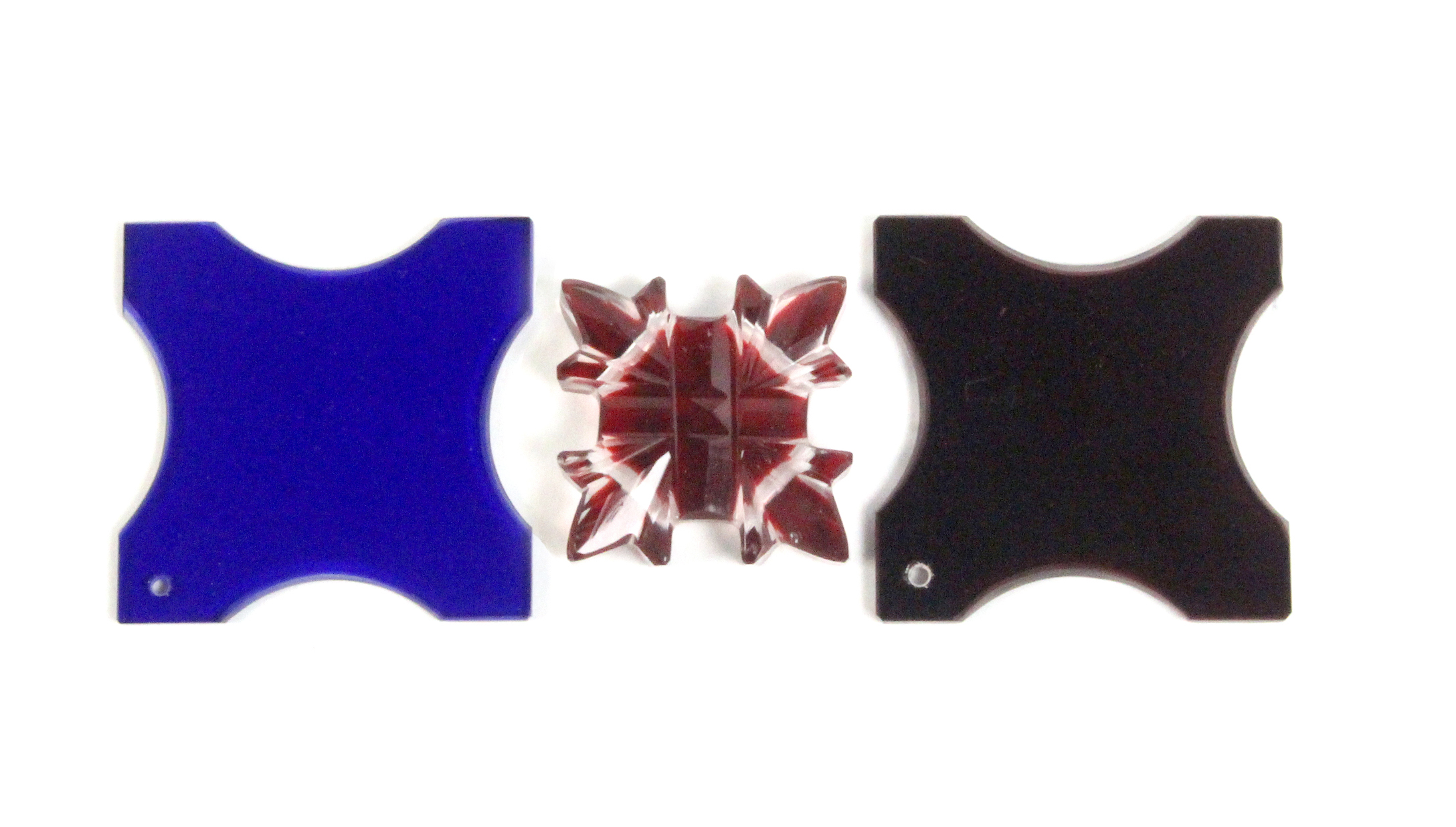 Three scarce glass thread winders comprising a pair one blue, one red, of square form with inward