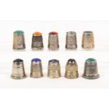 Ten English silver 'stone' top thimbles, all late 20th Century including examples by Swann