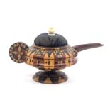 A Tunbridge ware pin cushion in the form of a teapot, in turned stick ware with roundel form handle,