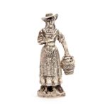 An attractive 19th Century French silver figural needle case in the form of a woman wearing a