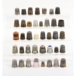 Thirty-nine various thimbles including eight silver examples (39)