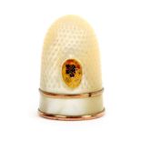 A mother of pearl Palais Royal thimble with gilt metal and enamel pansy motif, the plain frieze