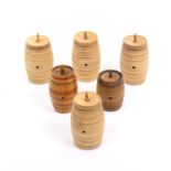 Six whitewood cotton barrels comprising a set of four in plain whitewood and two variant examples