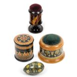 Mauchline ware - sewing - four alternate finishes comprising a green ground floral decorated thimble