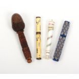 Four needle cases comprising a coquilla example with acorn thimble case end, a coloured beadwork