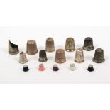 Seven children's thimbles and others comprising a thimble guard with engraved border and vacant