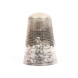 A French silver 'fairy tale' thimble, 'The Milkmaid and the Pot of Milk', with gate, village