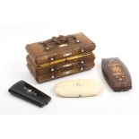 A Victorian leather sewing box and three etui cases, the box in brown leather with gilt and mother