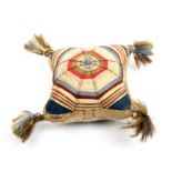 A fine early Georgian silk pin cushion of cushion form with tasselled corners each side worked in