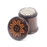 A Tunbridge ware rosewood cylinder form nutmeg grater, the overhanging lid in geometric mosaic,