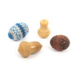 Four thimble cases comprising a bone egg form example covered in blue and white geometric