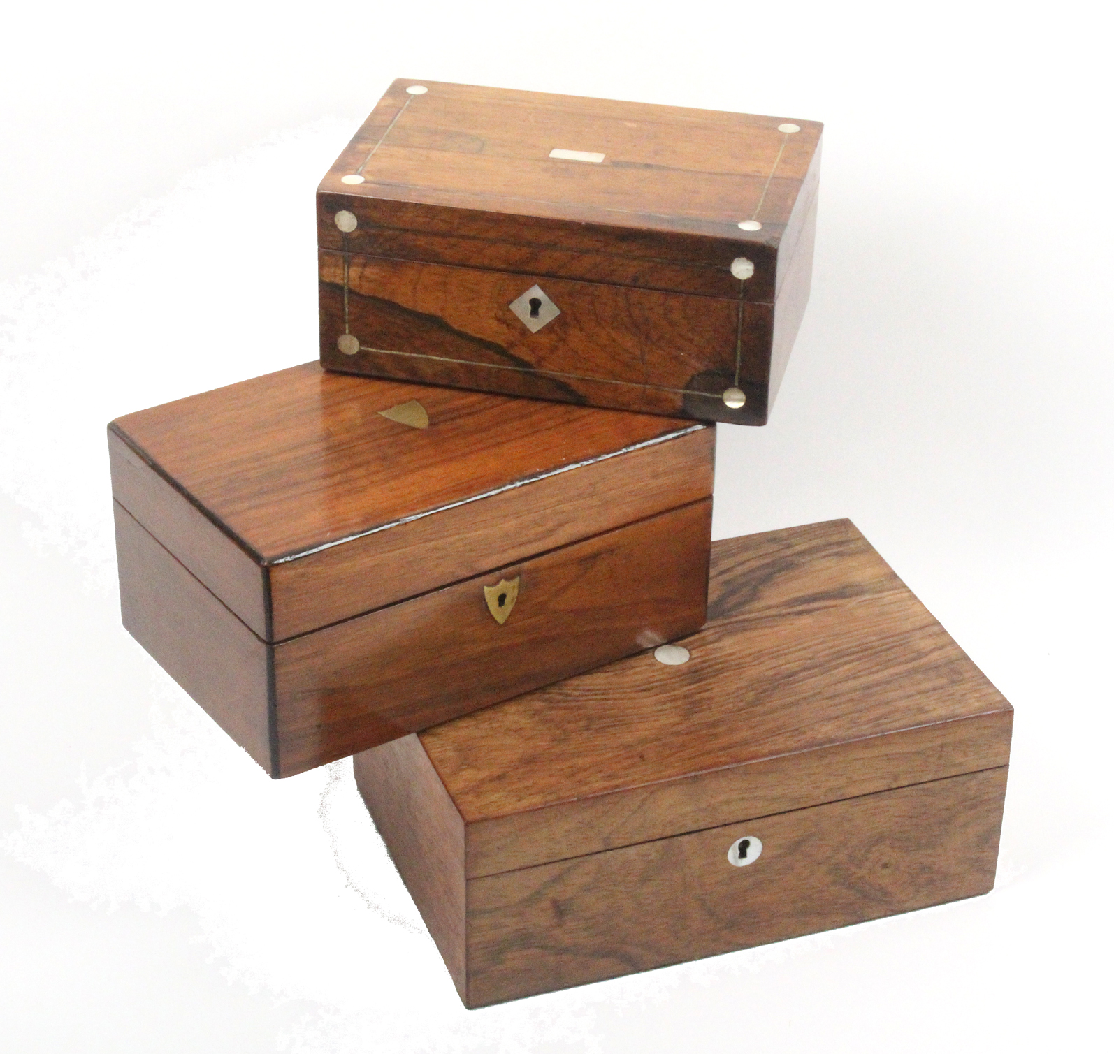 Three Victorian sewing boxes comprising a rosewood rectangular example with pewter lines and