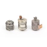 Three 19th Century silver tape measures comprising a silver filigree example lacking tape, 2.3cm,