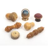 Seven vegetable ivory sewing tools comprising a pear shaped thimble case, 5cm, another of acorn form