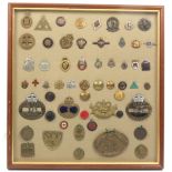 Buttons and badges - a framed display of mostly badges with a few buttons comprising a good