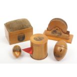 Mauchline ware - five pieces comprising a pin cushion in the form of a knife grinder (photographic/