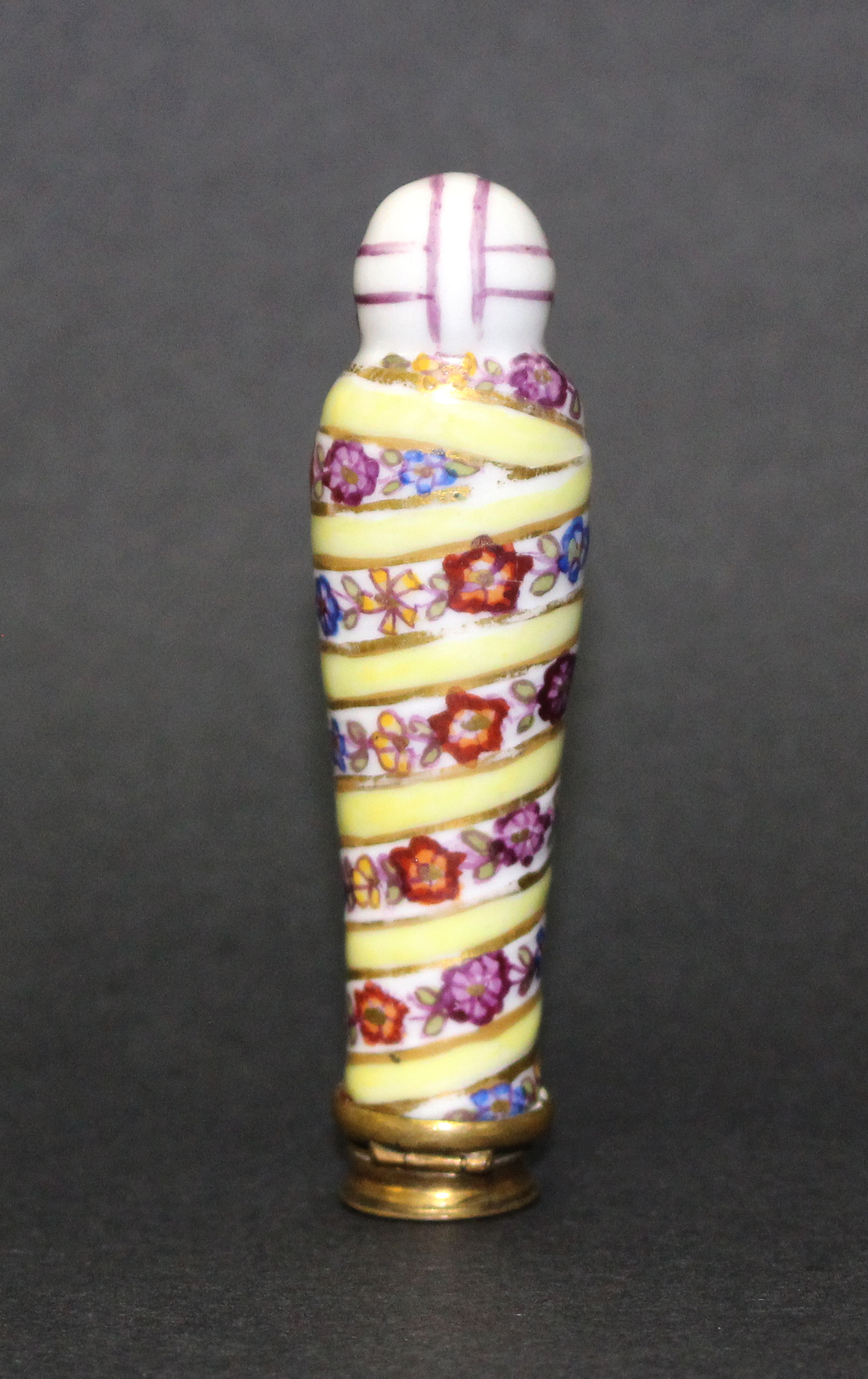 A 19th Century continental porcelain needle case in the form of a swaddled baby wearing a bonnet, - Image 2 of 2