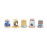 Five attractive continental silver and enamel decorated thimbles comprising two with floral enamel