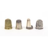 Three silver thimbles and a brass example comprising a silver 'Thimble nail' - Pat. 19157, London