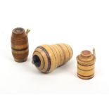 Two early painted Tunbridge ware tape measures and a thimble case, comprising a barrel from