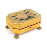 A Regency pressed paper and painted velour sewing box of canted rectangular form on gilt brass paw