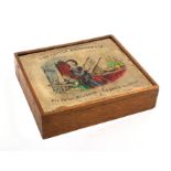 An embroidery frame for a child, contained in a rectangular wooden box, the sliding lid with