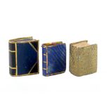 Two 19th Century book form pin cushions and an emery, the emery in blue star decorated paper with