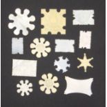 Thirteen various thread winders comprising a large Chinese engraved snowflake, 5cm, eight other